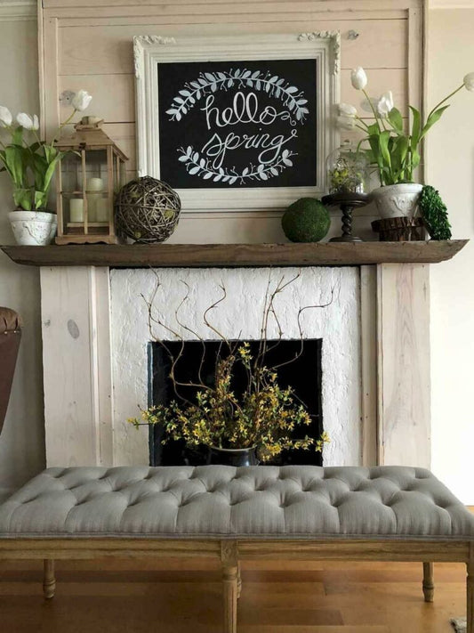 Reclaimed wood fireplace mantel in living room with decor