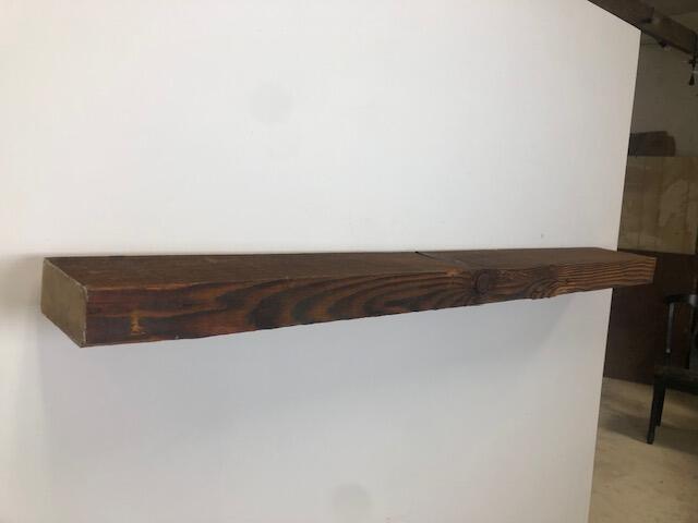 60" Reclaimed Barn Wood Fireplace Mantel Shelf - 3x7 on white wall left angle view