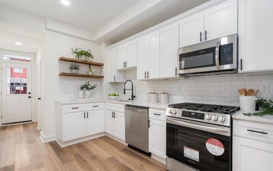 Dark reclaimed wood floating shelves with kitchen decor