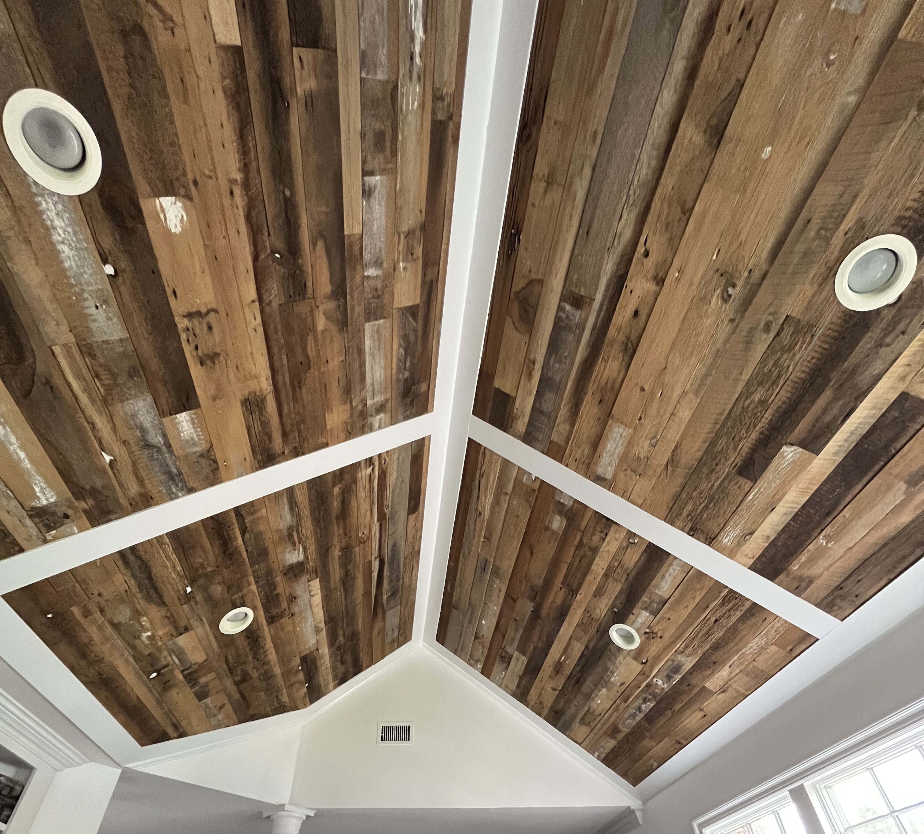 Authentic reclaimed ceiling paneling
