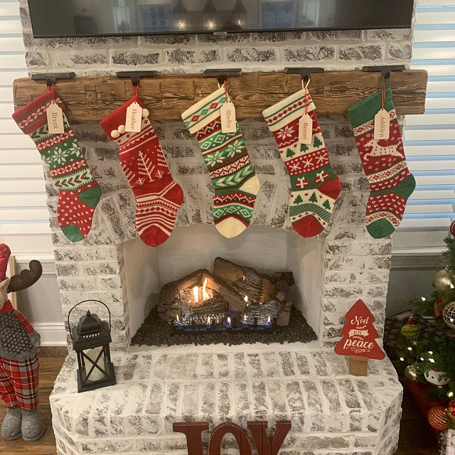 reclaimed fireplace mantel with Christmas stockings hung