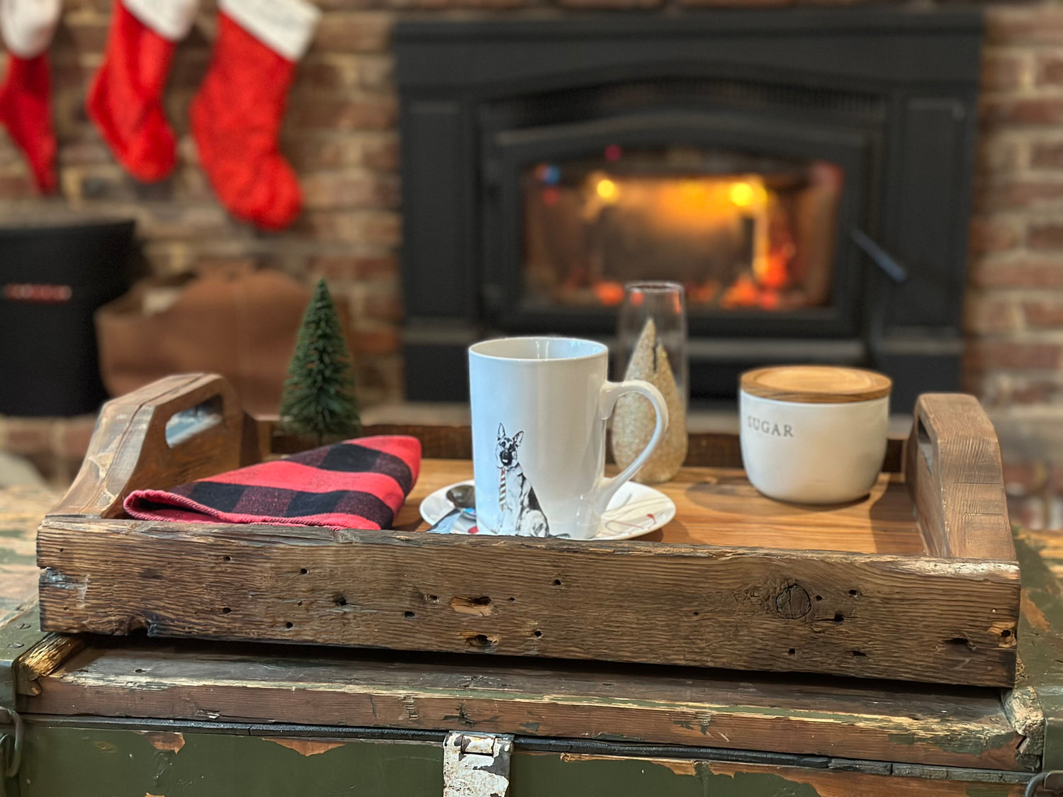 reclaimed wood tray with coffee cups inf front of fireplace