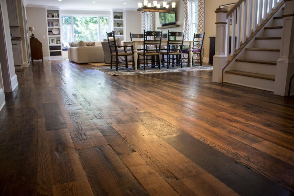 Heartland Barnwood Oak Red & White Mixed Skip-Planed Brown wood flooring close up with blurred background 2