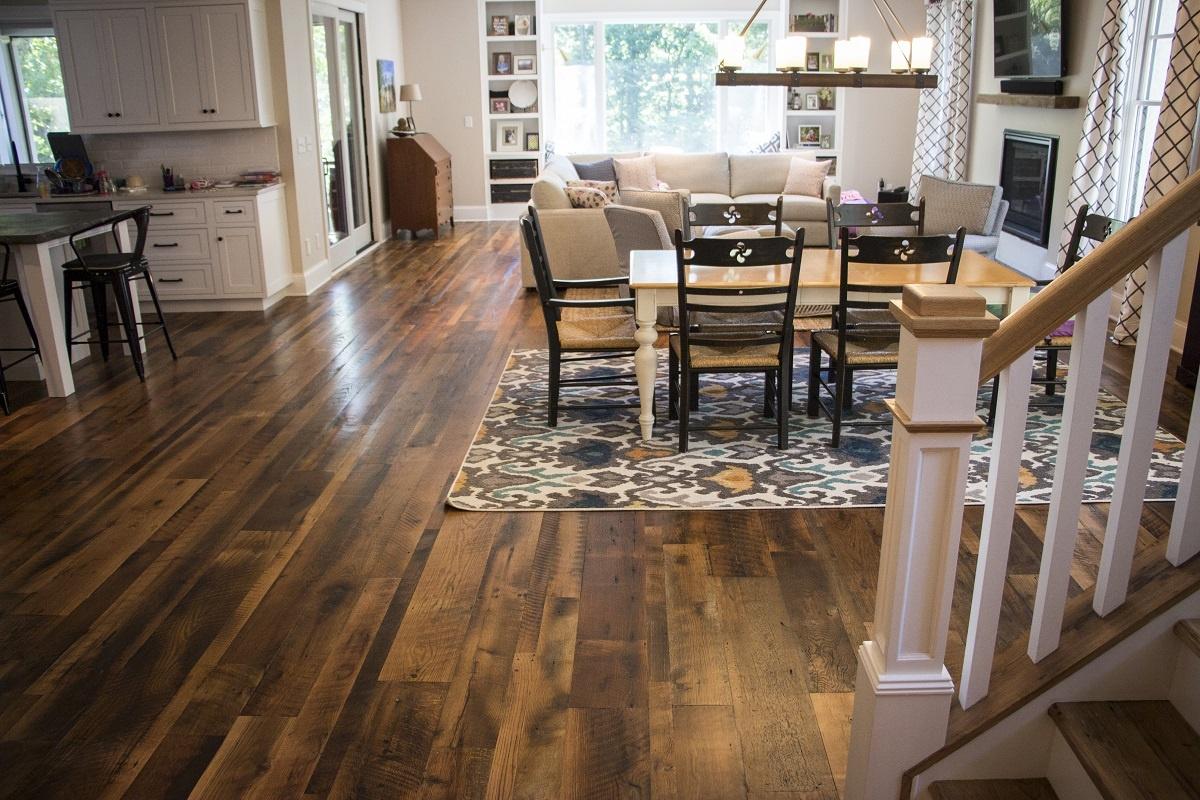 Heartland Barnwood Oak Red & White Mixed Skip-Planed Brown wood flooring in dining area viewed from stairs.