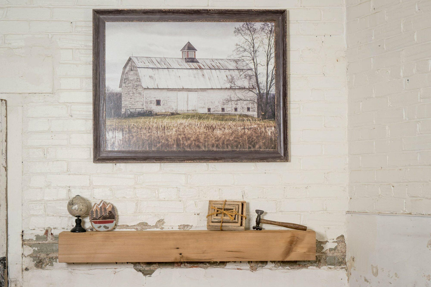 a reclaimed wood rustic fireplace mantel. The mantel is the natural color of the wood and texture, knots, and nail holes are present in the wood.