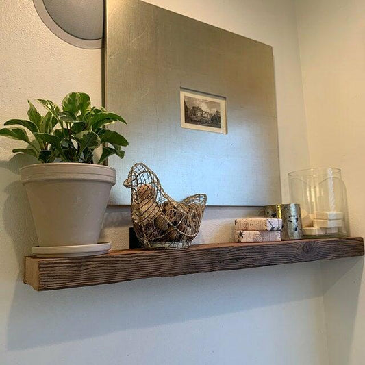 reclaimed barnwood shelf showing a prominent grain pattern.