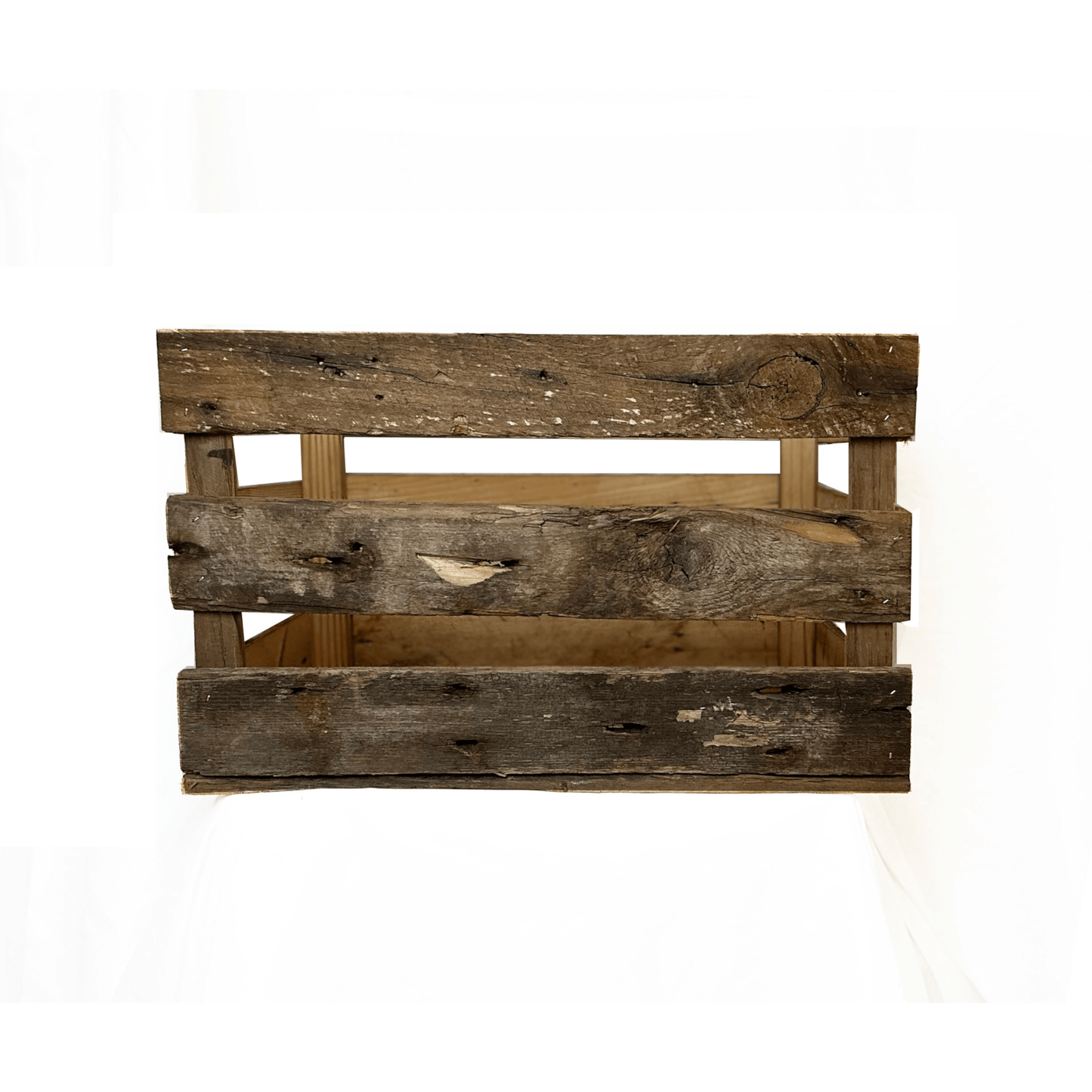 reclaimed wood crate with spaces in between the slats. There are three slats with an equal space in between. Wood displays distressed characteristics.