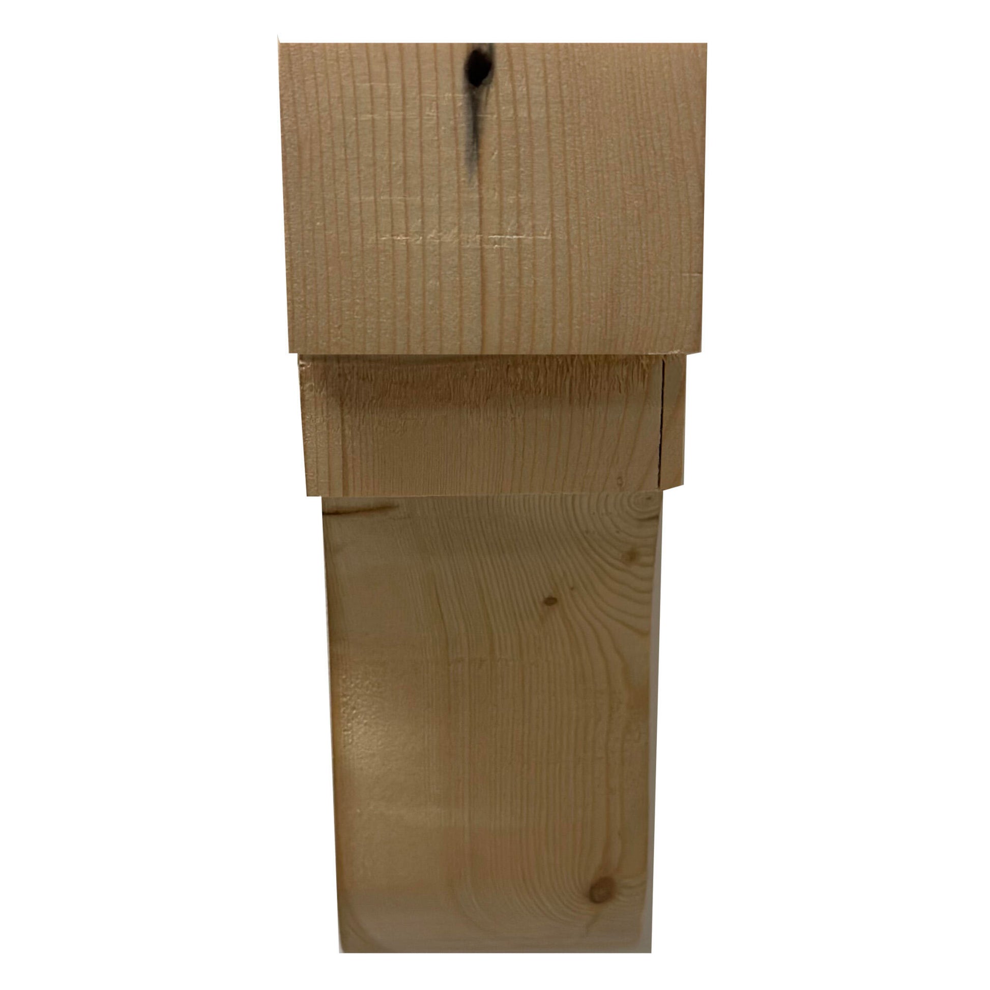 front view of the corbel showing the larger and smaller step along with the arch. Grain pattern and nail hole displayed in the wood.