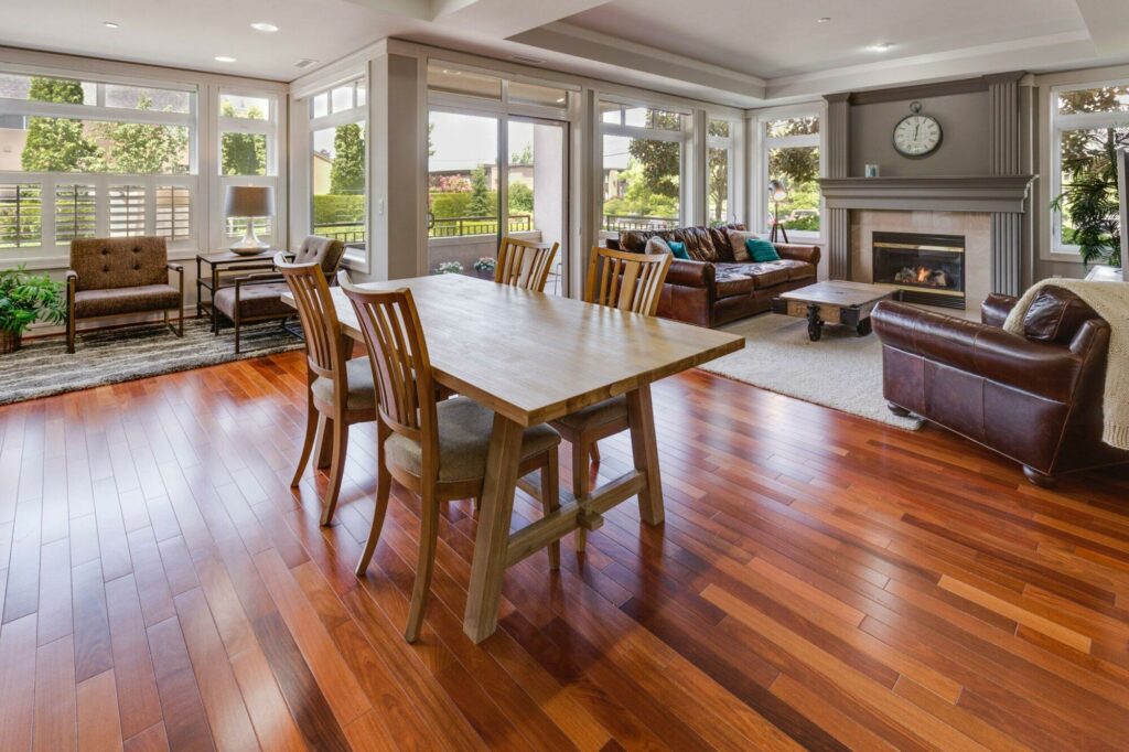 Reclaimed wood flooring in dining room and living room