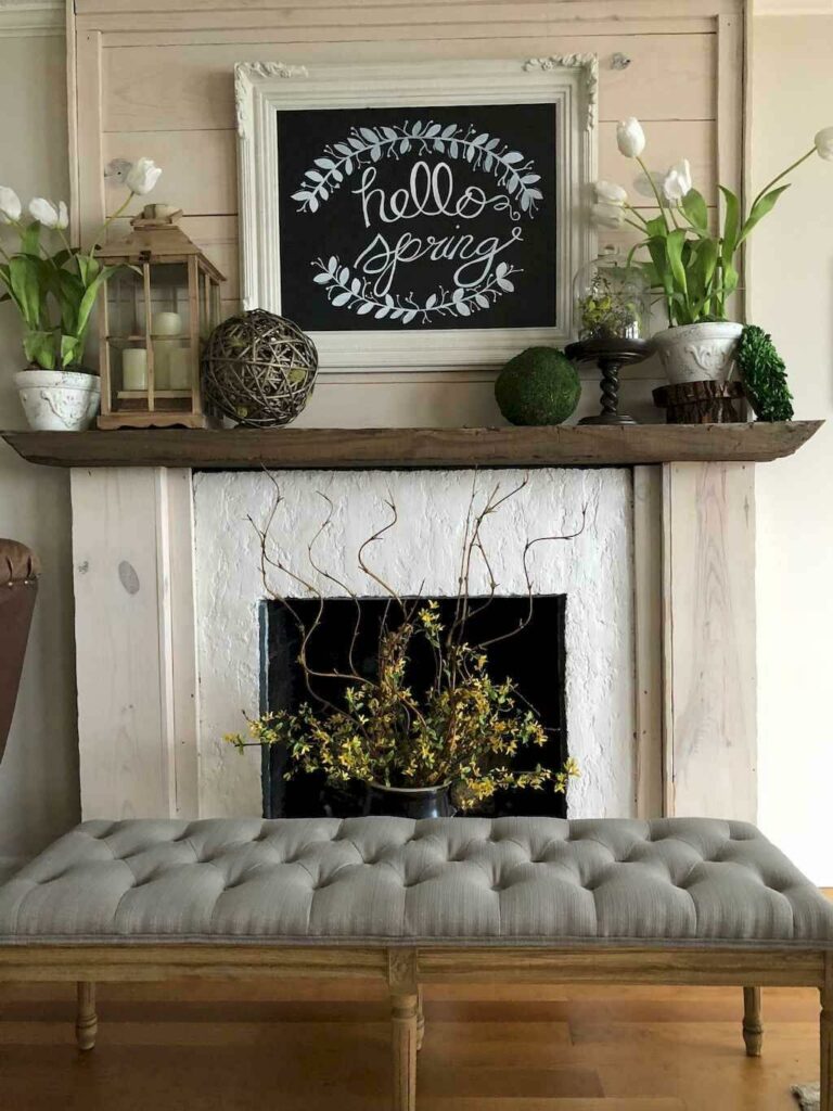 Reclaimed wood fireplace mantel in living room with decor