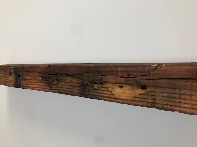 60" Reclaimed Barn Wood Fireplace Mantel Shelf - 3x7 on white wall front view close up