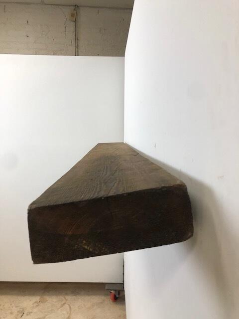 66" Skip-Planed Reclaimed Barn Wood Fireplace Mantel Shelf - 3x8 on white wall right side view