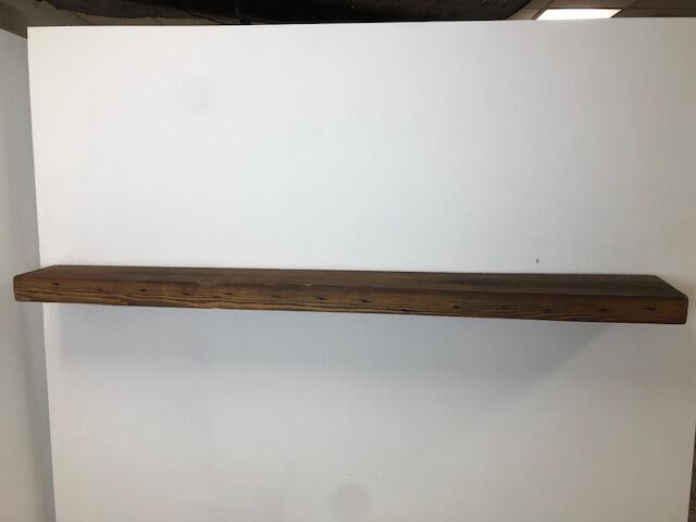 66" Skip-Planed Reclaimed Barn Wood Fireplace Mantel Shelf - 3x8 on white wall front view 2