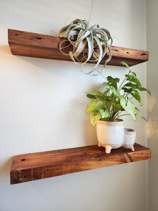reclaimed wood floating shelves in an oil finish