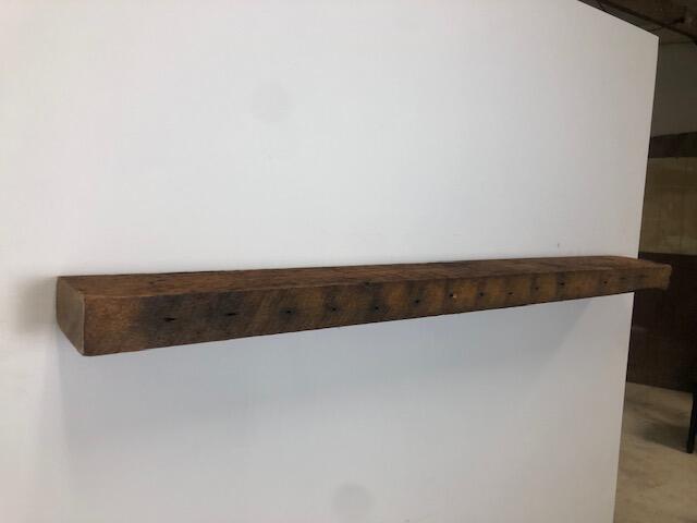 60" Reclaimed Barn Wood Fireplace Mantel Shelf - 3x7 on white wall left angled view