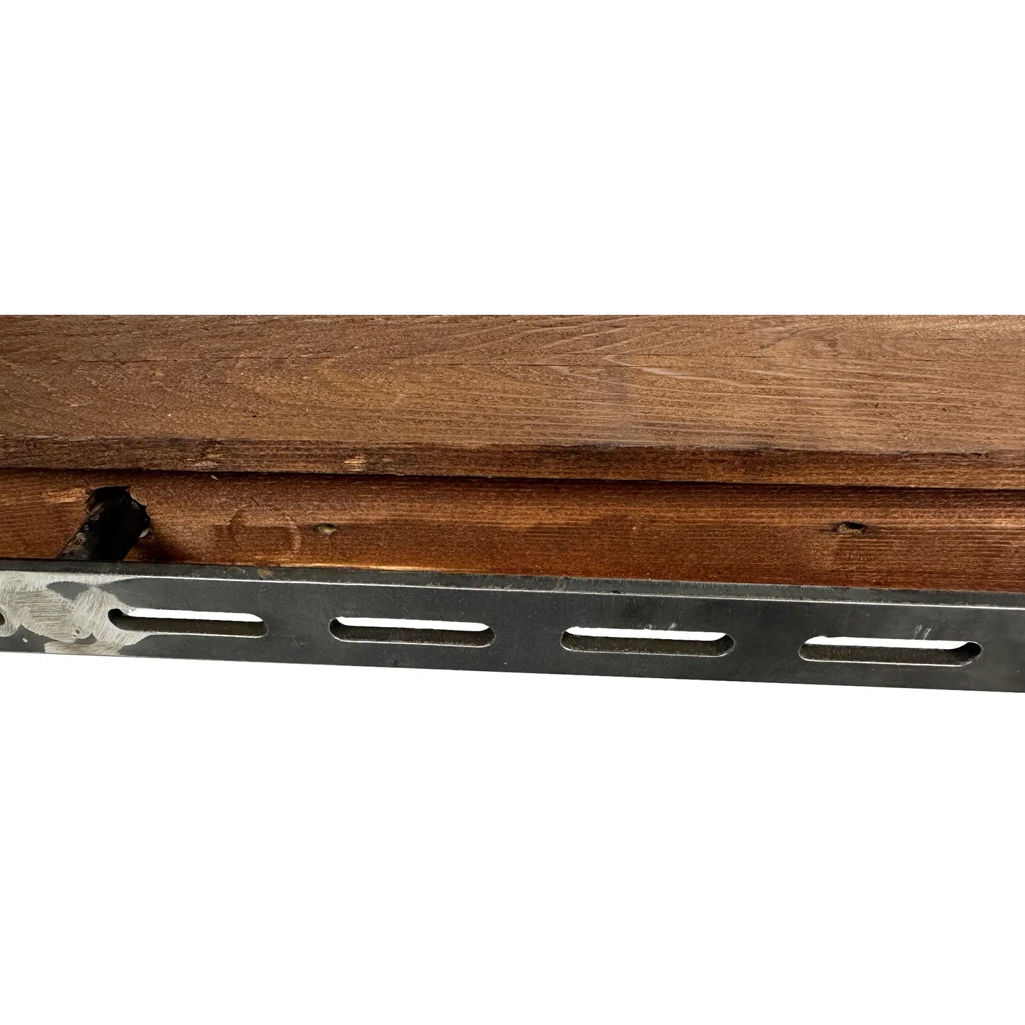 a close up of the back of a reclaimed wood floating shelf. There is a bracket with a peg partially in the back of the shelf to demonstrate installation.