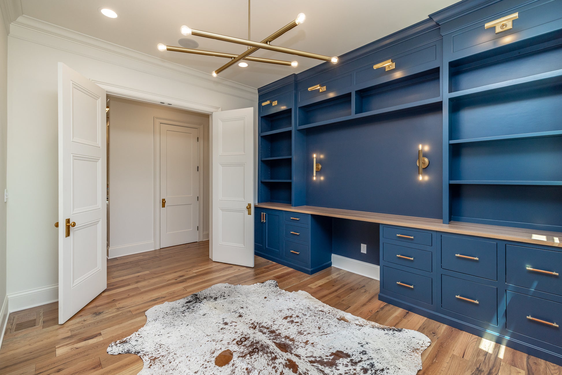 Heartland Barnwood Mixed Hardwoods Clean Face wood flooring room with blue wood cabinets and wood counter top.