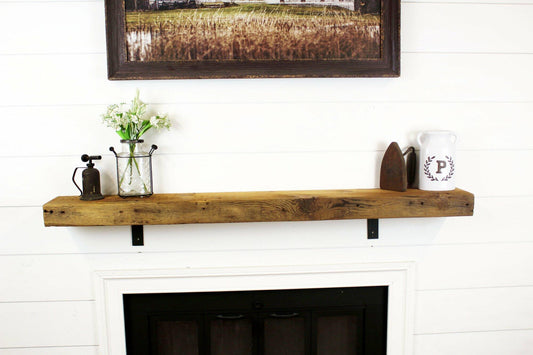 skip-planed reclaimed barnwood fireplace mantel shown in the natural option. Grain patterns, knots, and nail holes are present in the face of the mantel.