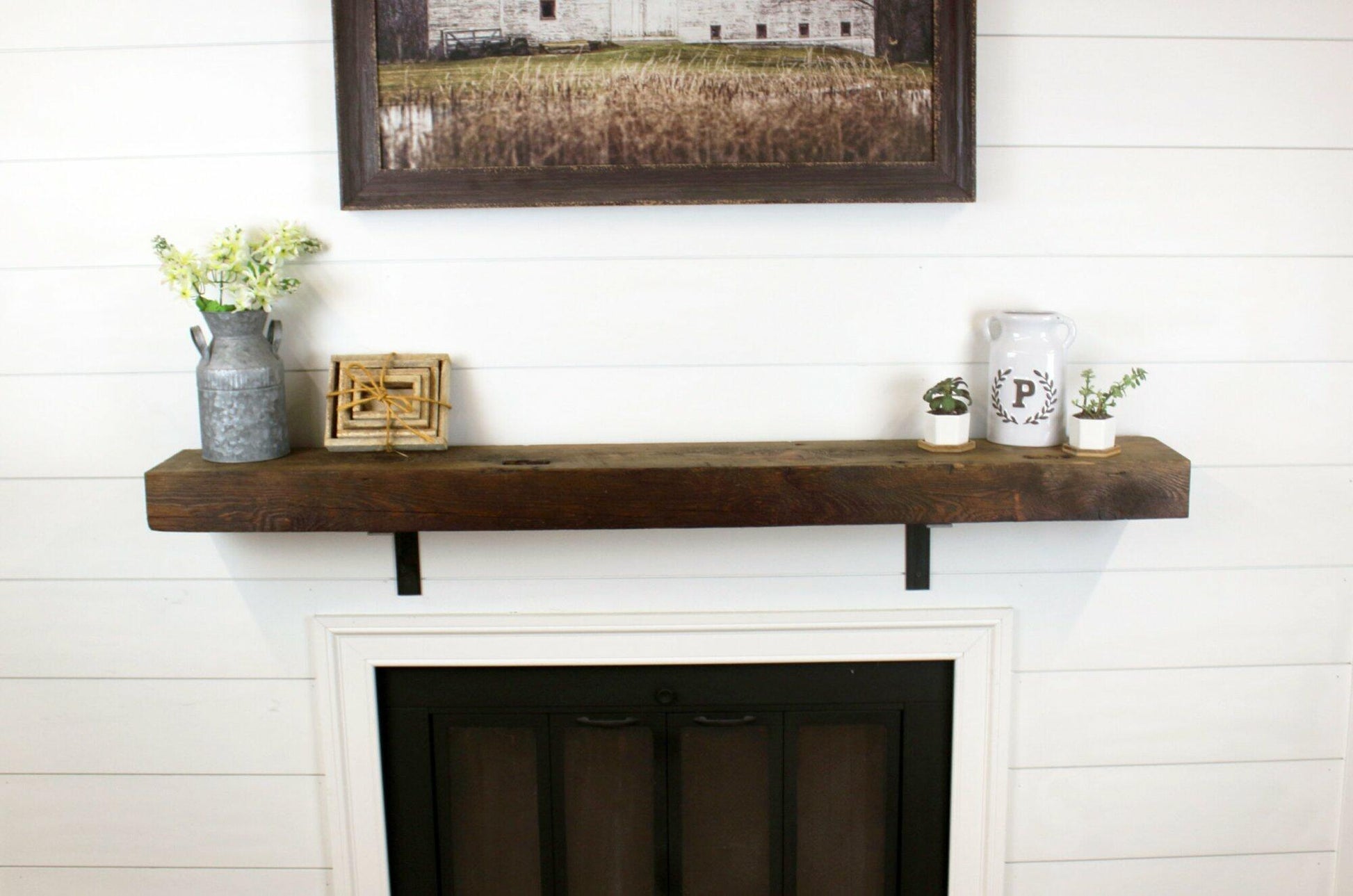 a skip-planed reclaimed barnwood fireplace mantel in the early american finish.
