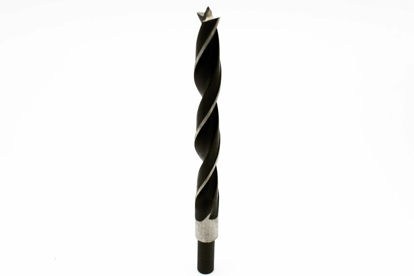 fluted shank self centering drill bit shown vertically that is used for drilling into wood