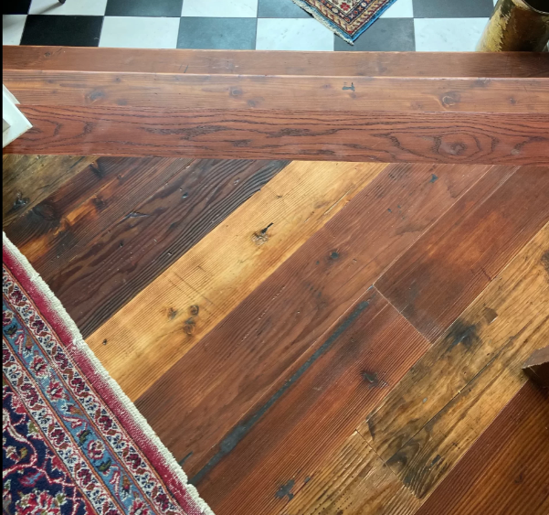 Douglas Fir reclaimed wood  close up with rug and black and white checkered floor