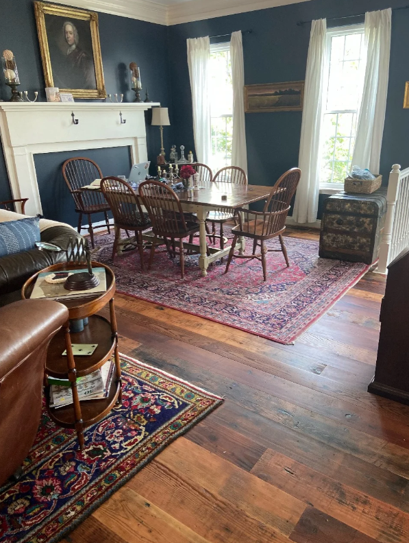 Douglas Fir reclaimed wood flooring in living room connecting dining area with furniture
