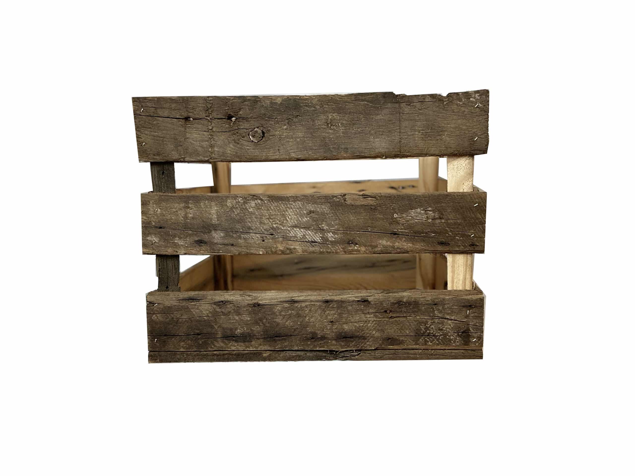 reclaimed wood crate with spaces in between the slats. There are three slats with an equal space in between. Wood displays distressed characteristics.