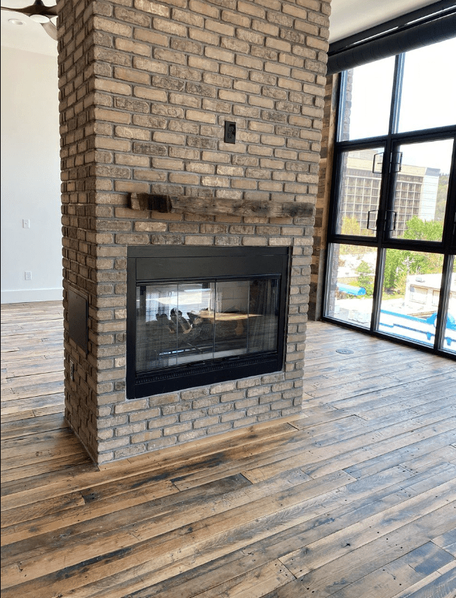 Reclaimed Industrial Oak Engineered Flooring in common areal with fireplace