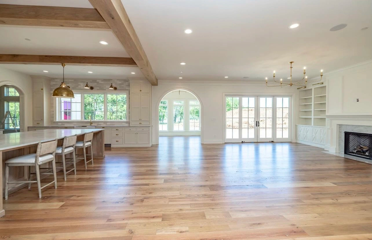 Heartland Barnwood Oak Red & White Mixed Clean Face wood flooring in living room with fireplace and white walls