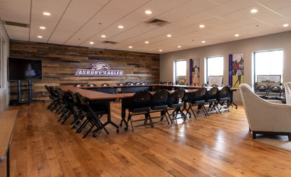 Racehorse Oak Red & White Mix Clean Face wood flooring used in a meeting room with wood wall paneling for accent wall.