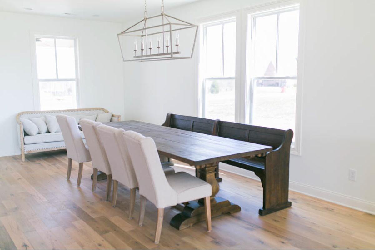 Racehorse Oak Red & White Mix Clean Face flooring in dinning room with wood table, wood bench and vintage chairs