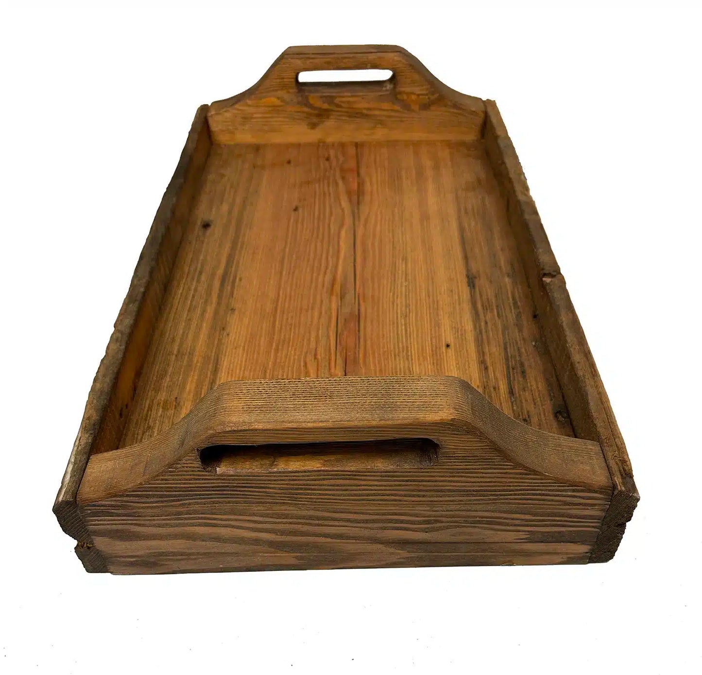 wood serving tray at a wider angle. In view is the handles, tray surface, and grain patterns displayed in the wood.