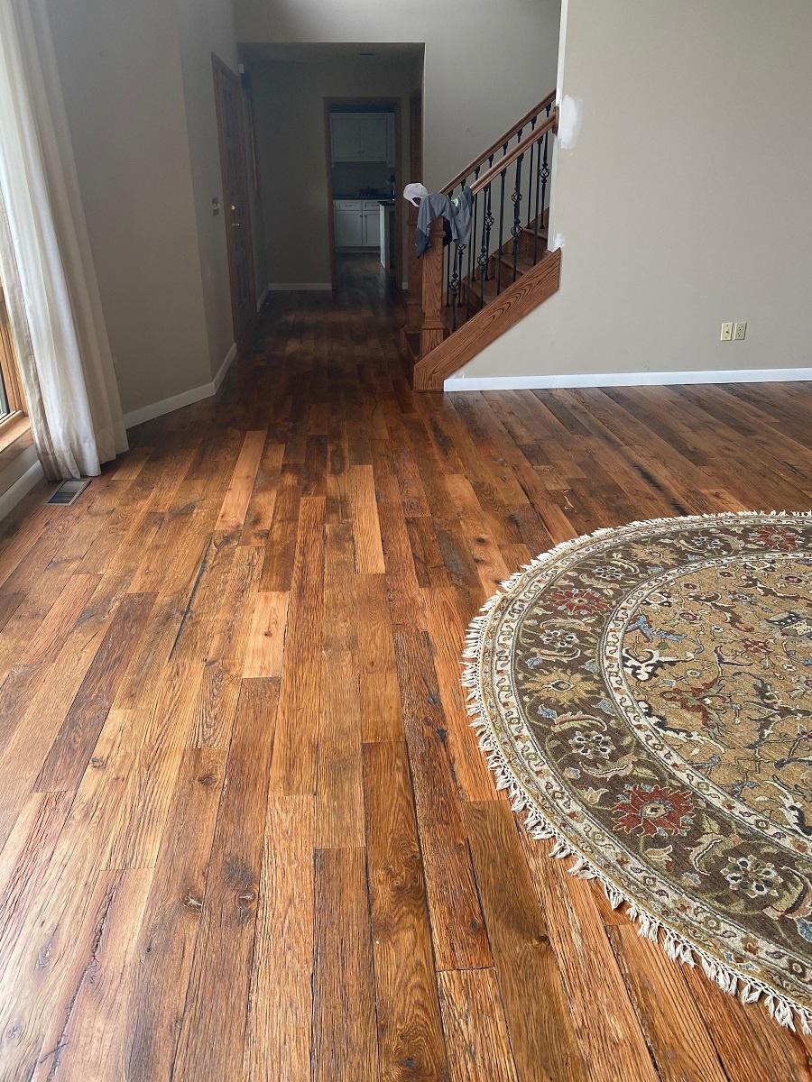 Racehorse Oak Red & White Mix Skip/Wire-Brushed flooring in common area