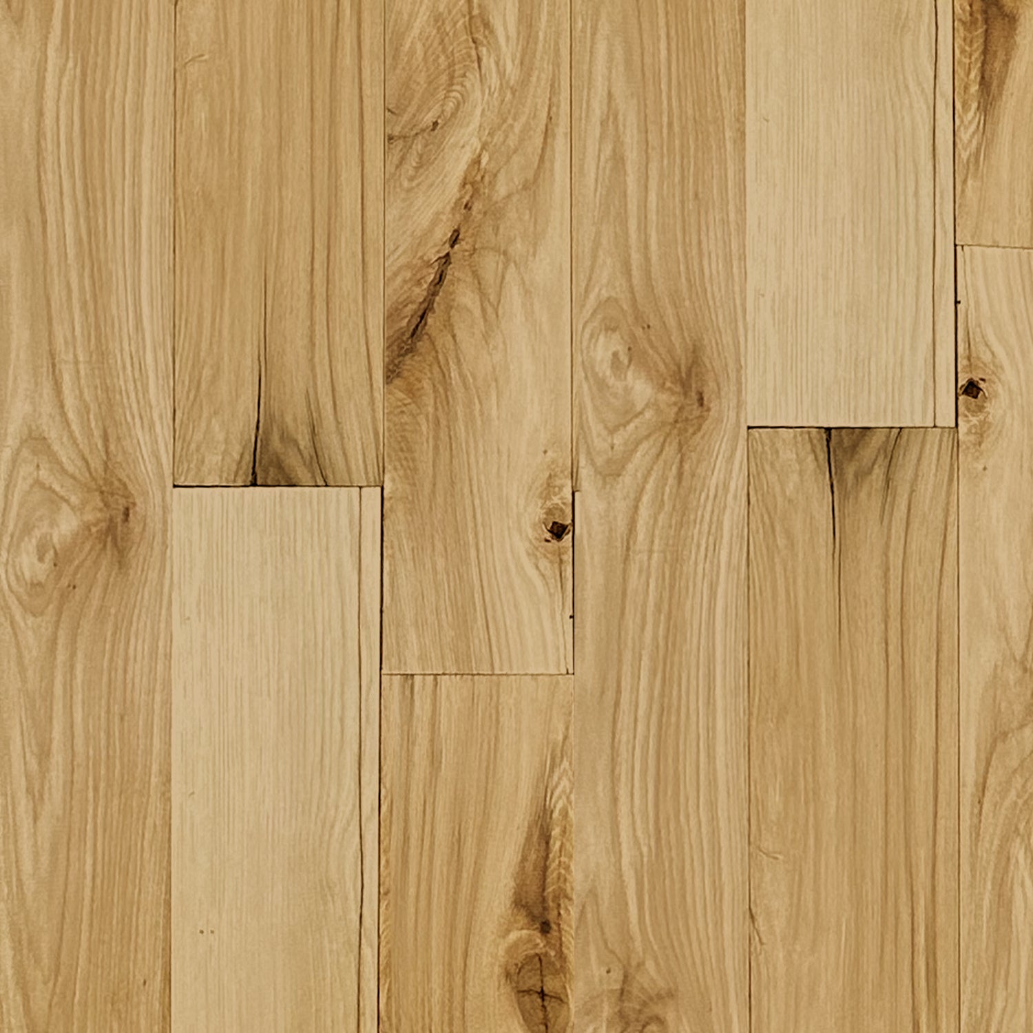 close up showing reclaimed hickory flooring installed. Wood grain, knots, and checking present in the flooring.