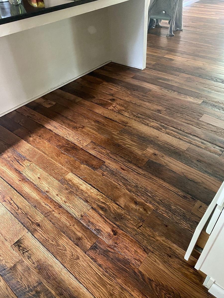 Close up of Racehorse Oak Red & White Mix Skip/Wire-Brushed flooring in kitchen