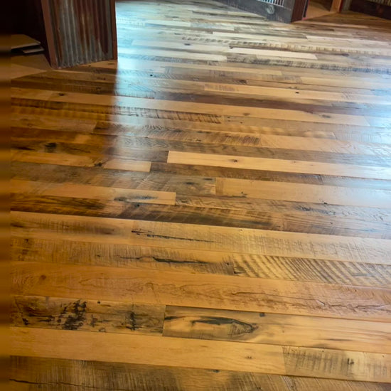 Video of Heartland Barnwood Mixed Hardwoods Skip-Planed Brown flooring and wood wall trim in barn style room 2