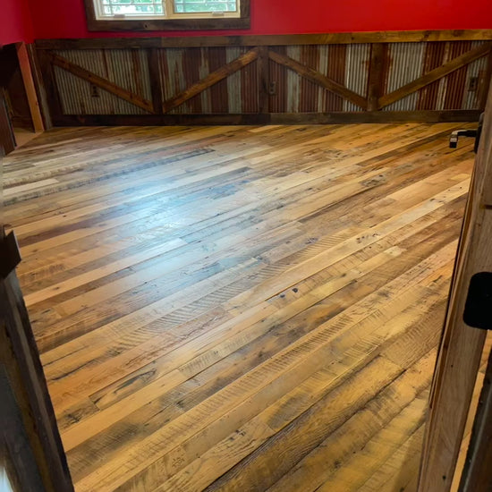 Video of Heartland Barnwood Mixed Hardwoods Skip-Planed Brown flooring and red walls with wood wall trim in barn style room 2