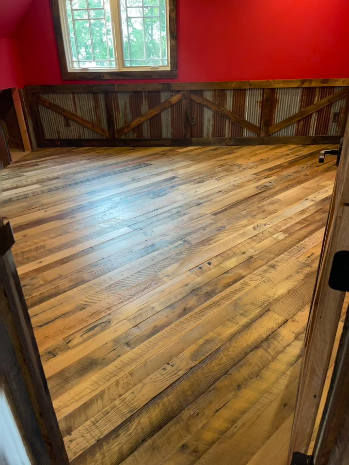 Video of Heartland Barnwood Mixed Hardwoods Skip-Planed Brown flooring and red walls with wood wall trim in barn style room 2