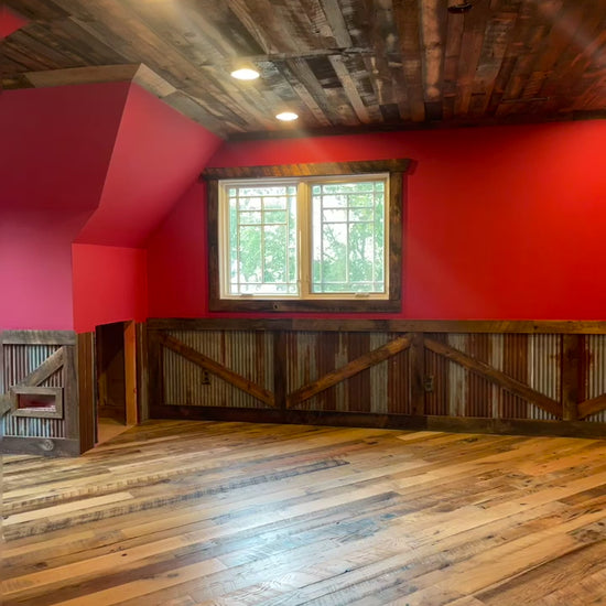 Video of Heartland Barnwood Mixed Hardwoods Skip-Planed Brown flooring and red walls with wood wall trim in barn style room 