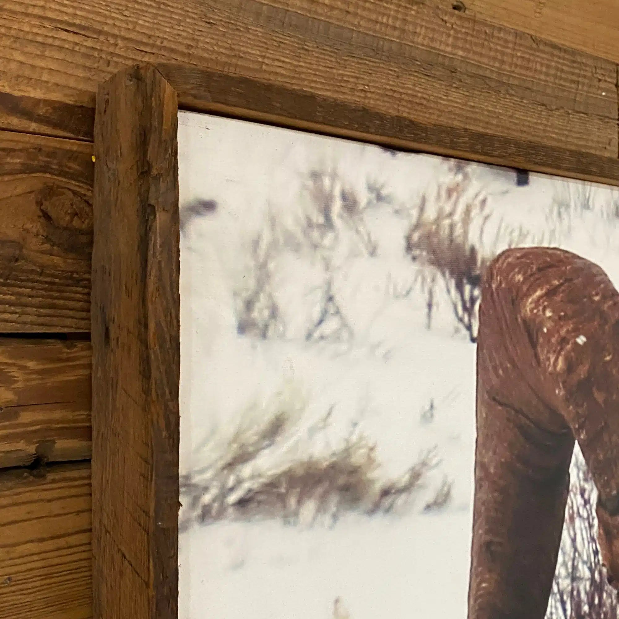 close up of reclaimed barnwood frame showing characteristics of wood and mitered corners.