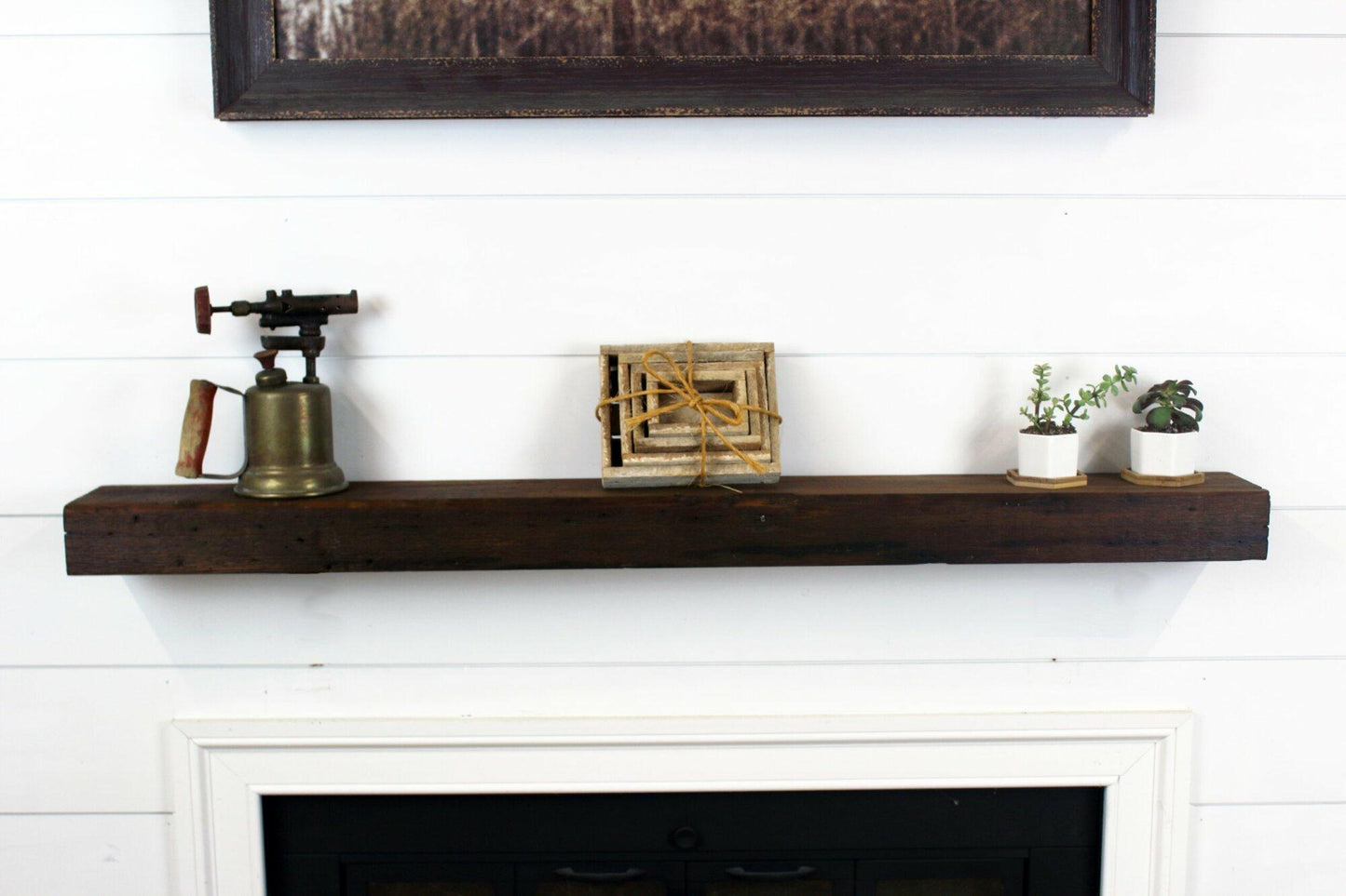 a skip-planed reclaimed barnwood fireplace mantel in the early american finish. 