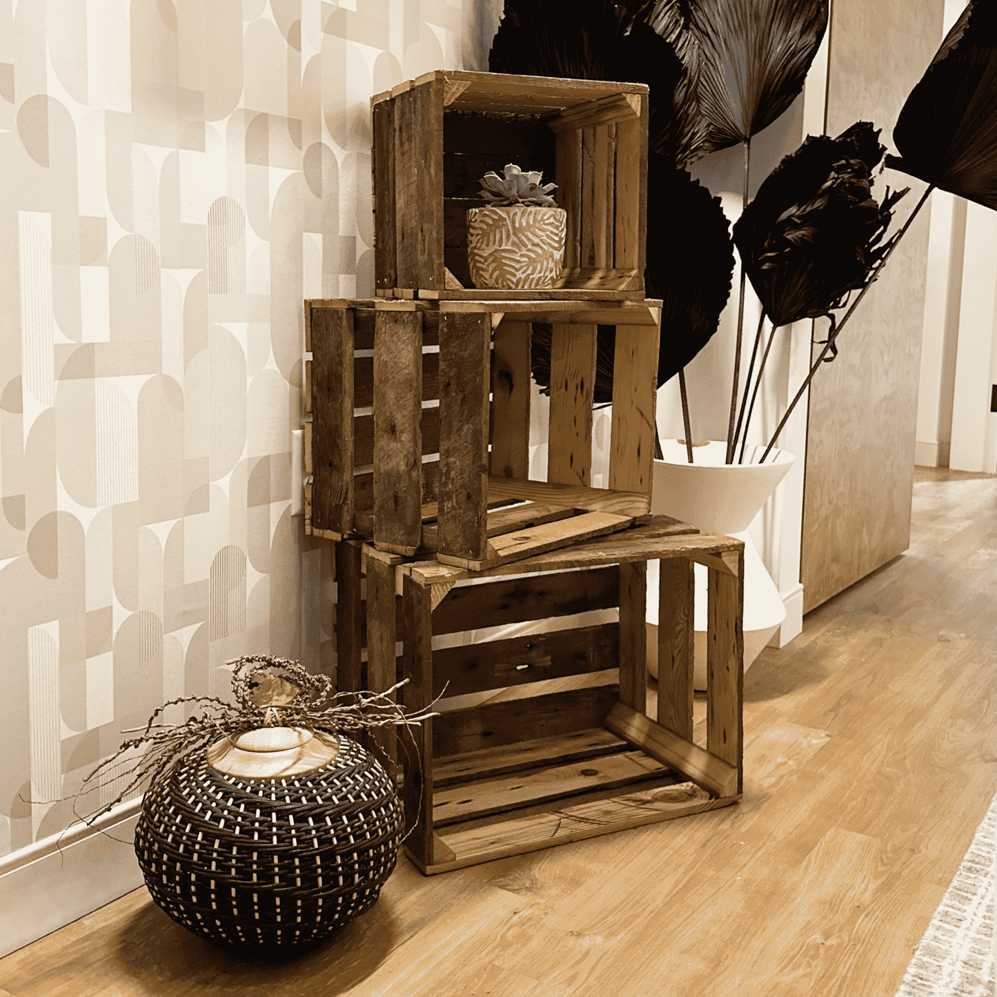 three reclaimed wooden crates stacked on top of one another in a small, medium, and large size. Shows both inside and outside of crates displaying wood variation and construction.